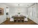 Dining room featuring a stylish chandelier and accent wall at 2484 E Lodgepole Dr, Gilbert, AZ 85298