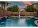 Relaxing poolside with sun loungers near a lush garden backdrop. The perfect spot for serene outdoor enjoyment at 2484 E Lodgepole Dr, Gilbert, AZ 85298