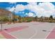 Outdoor community basketball court featuring hoops, marked lines, and mountain views at 2525 W Sat Nam Way, Phoenix, AZ 85086