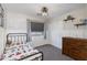 Cozy bedroom featuring a single bed, chest of drawers, closet, and window with blinds at 2525 W Sat Nam Way, Phoenix, AZ 85086