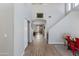 Bright foyer with wood floors leading to the living area, featuring stairs and neutral paint at 2525 W Sat Nam Way, Phoenix, AZ 85086