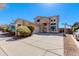 Charming two-story home featuring a landscaped front yard, concrete driveway, and an inviting entrance at 2525 W Sat Nam Way, Phoenix, AZ 85086