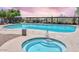 Community pool area showcasing a sparkling pool and an adjacent jacuzzi, perfect for relaxation at 2525 W Sat Nam Way, Phoenix, AZ 85086