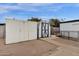 View of backyard featuring a shed, gravel landscaping, and a storage shed at 2570 W Scenic St, Apache Junction, AZ 85120