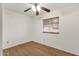 Cozy bedroom featuring wood-look flooring and a ceiling fan at 2570 W Scenic St, Apache Junction, AZ 85120