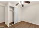 Bright bedroom with wood-look flooring and closet at 2570 W Scenic St, Apache Junction, AZ 85120