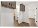 Hallway with built-in cabinets leads to the laundry room and another bedroom at 2570 W Scenic St, Apache Junction, AZ 85120