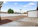 Large gravel backyard with mature trees and a gazebo is ready for landscaping at 2834 N 65Th Ave, Phoenix, AZ 85035