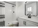 Well-lit bathroom features a modern shower with a black shower head and sink fixtures at 2834 N 65Th Ave, Phoenix, AZ 85035