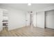 A clean bedroom featuring new light wood flooring and freshly painted white walls at 2834 N 65Th Ave, Phoenix, AZ 85035