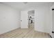 Bedroom featuring wood floors and a partial view of the kitchen at 2834 N 65Th Ave, Phoenix, AZ 85035