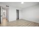 Bedroom with a closet and wood floors leading to a bathroom at 2834 N 65Th Ave, Phoenix, AZ 85035