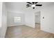 Spacious bedroom with wood floors and a ceiling fan at 2834 N 65Th Ave, Phoenix, AZ 85035