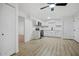 Modern open kitchen with stainless steel appliances and white cabinets, with a black faucet at 2834 N 65Th Ave, Phoenix, AZ 85035