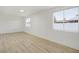 Bright living room featuring new wood floors and large windows at 2834 N 65Th Ave, Phoenix, AZ 85035