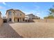 Large rock-landscaped backyard offering privacy and low maintenance at 28793 N Spur Dr, San Tan Valley, AZ 85143