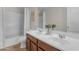 Bathroom with double sink vanity, framed mirror and shower-tub combination at 28793 N Spur Dr, San Tan Valley, AZ 85143