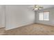 Neutral bedroom with carpet, window with blinds, and ceiling fan at 28793 N Spur Dr, San Tan Valley, AZ 85143