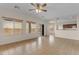 Sun-filled living room with tiled floors and sliding glass door to the patio at 28793 N Spur Dr, San Tan Valley, AZ 85143