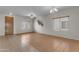 Bright living room features tile floors, ceiling fan, and lots of natural light at 28793 N Spur Dr, San Tan Valley, AZ 85143