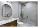 Modern bathroom featuring a sleek vanity with gold accents and a frameless glass shower at 2964 E Palo Verde St, Gilbert, AZ 85296