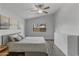 Bright and airy bedroom featuring a queen bed, wood-look flooring, and natural light at 3018 W Matthew Dr, Phoenix, AZ 85027