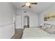 Bright bedroom featuring light walls, wood floors, ceiling fan, and a coordinated color scheme at 3018 W Matthew Dr, Phoenix, AZ 85027