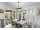 Charming dining area with sliding glass doors to the patio, a modern light and an easter-themed centerpiece at 3018 W Matthew Dr, Phoenix, AZ 85027