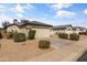 A single-story home with a two-car garage, desert landscaping, and well-kept curb appeal at 3018 W Matthew Dr, Phoenix, AZ 85027