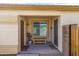 Welcoming front porch with seating, a large window, and dual entry doors under a covered area at 3018 W Matthew Dr, Phoenix, AZ 85027