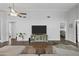 Inviting living room featuring neutral tones, wood flooring, and entertainment center at 3018 W Matthew Dr, Phoenix, AZ 85027