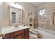 Cozy bathroom with tiled shower/tub combo and a single sink vanity at 3032 N 160Th Ave, Goodyear, AZ 85395