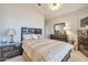 Serene bedroom with neutral tones, dark wood furniture, and a calming atmosphere at 3032 N 160Th Ave, Goodyear, AZ 85395