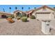 Charming home featuring desert landscaping, palm trees, and a two-car garage at 3032 N 160Th Ave, Goodyear, AZ 85395