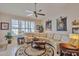 Inviting living room with neutral colors, a large area rug, and an oversized sofa at 3032 N 160Th Ave, Goodyear, AZ 85395