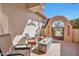 Relaxing patio space with comfortable seating and an outdoor fireplace feature at 3032 N 160Th Ave, Goodyear, AZ 85395