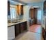 View of the kitchen featuring a stainless steel sink and ample cabinet space at 3104 E Broadway Rd # 268, Mesa, AZ 85204