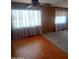 Living room featuring hard wood floor and window at 3104 E Broadway Rd # 268, Mesa, AZ 85204