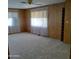 Bedroom featuring bright natural lighting, carpeting and closet at 3104 E Broadway Rd # 268, Mesa, AZ 85204