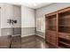 Bedroom featuring wood floors, window shutters and built-in cabinets at 3191 N 160Th Ave, Goodyear, AZ 85395