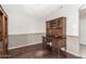 Bedroom featuring desk with dark wood finish, hutch and trim at 3191 N 160Th Ave, Goodyear, AZ 85395