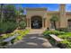 Elegant clubhouse entrance with manicured landscaping, offering a warm and welcoming atmosphere at 3191 N 160Th Ave, Goodyear, AZ 85395