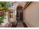 Inviting entryway featuring a wood door and tiled floor at 3191 N 160Th Ave, Goodyear, AZ 85395