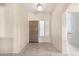 Inviting entryway featuring a wood door, tile floor, and plantation shutters at 3191 N 160Th Ave, Goodyear, AZ 85395