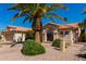 Charming single-story home featuring desert landscaping, a barrel tile roof, and an arched entryway at 3191 N 160Th Ave, Goodyear, AZ 85395