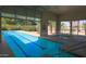 Bright indoor pool area featuring clear pool with an open door, offering an inviting spot for relaxation and fitness at 3191 N 160Th Ave, Goodyear, AZ 85395