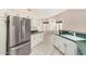 Bright kitchen with stainless steel appliances, white cabinets, and ample counter space for cooking at 3191 N 160Th Ave, Goodyear, AZ 85395