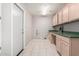 Well-lit laundry room featuring lots of storage and side-by-side hookups at 3191 N 160Th Ave, Goodyear, AZ 85395