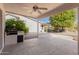 Covered patio featuring speckled concrete, ceiling fan, and a built-in outdoor grill perfect for entertaining at 3191 N 160Th Ave, Goodyear, AZ 85395