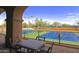 View from patio overlooking immaculate tennis courts; an active lifestyle dream at 3191 N 160Th Ave, Goodyear, AZ 85395